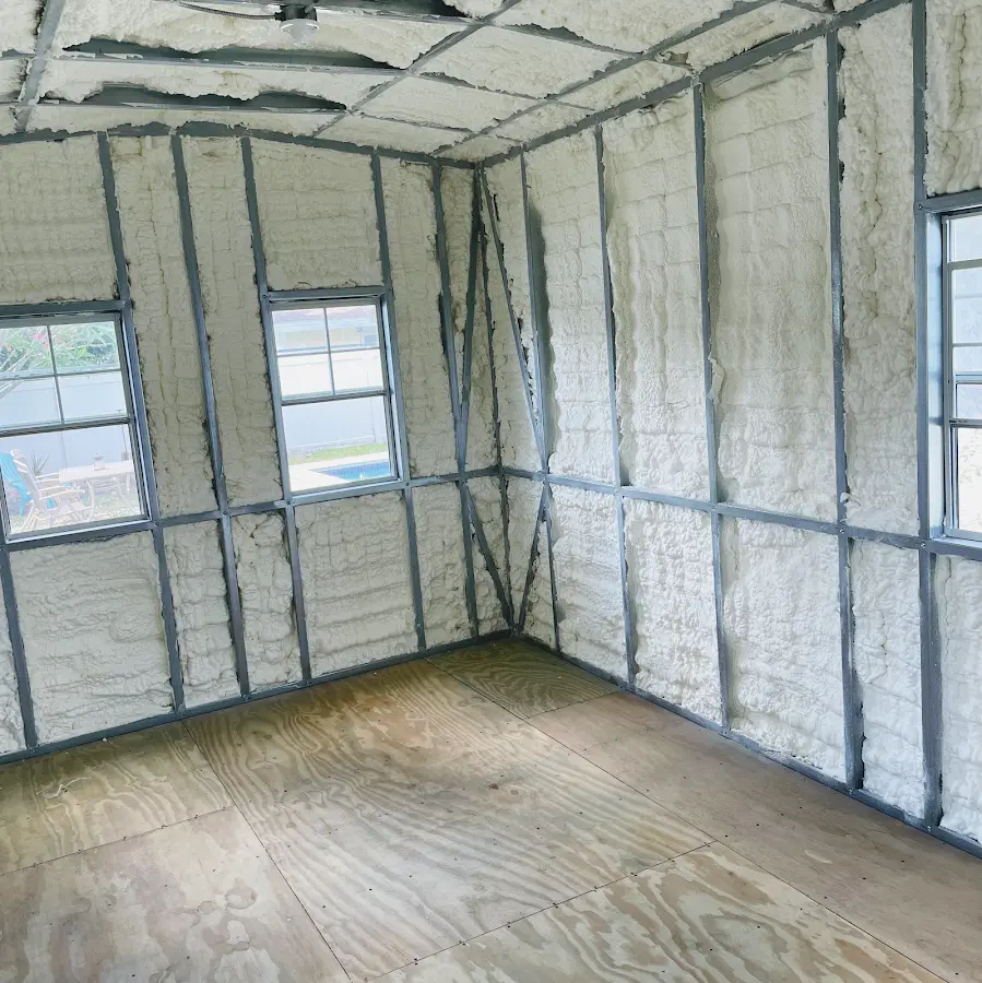 Closed-cell spray foam insulation applied to wall cavities in a residential project in Lawrenceville